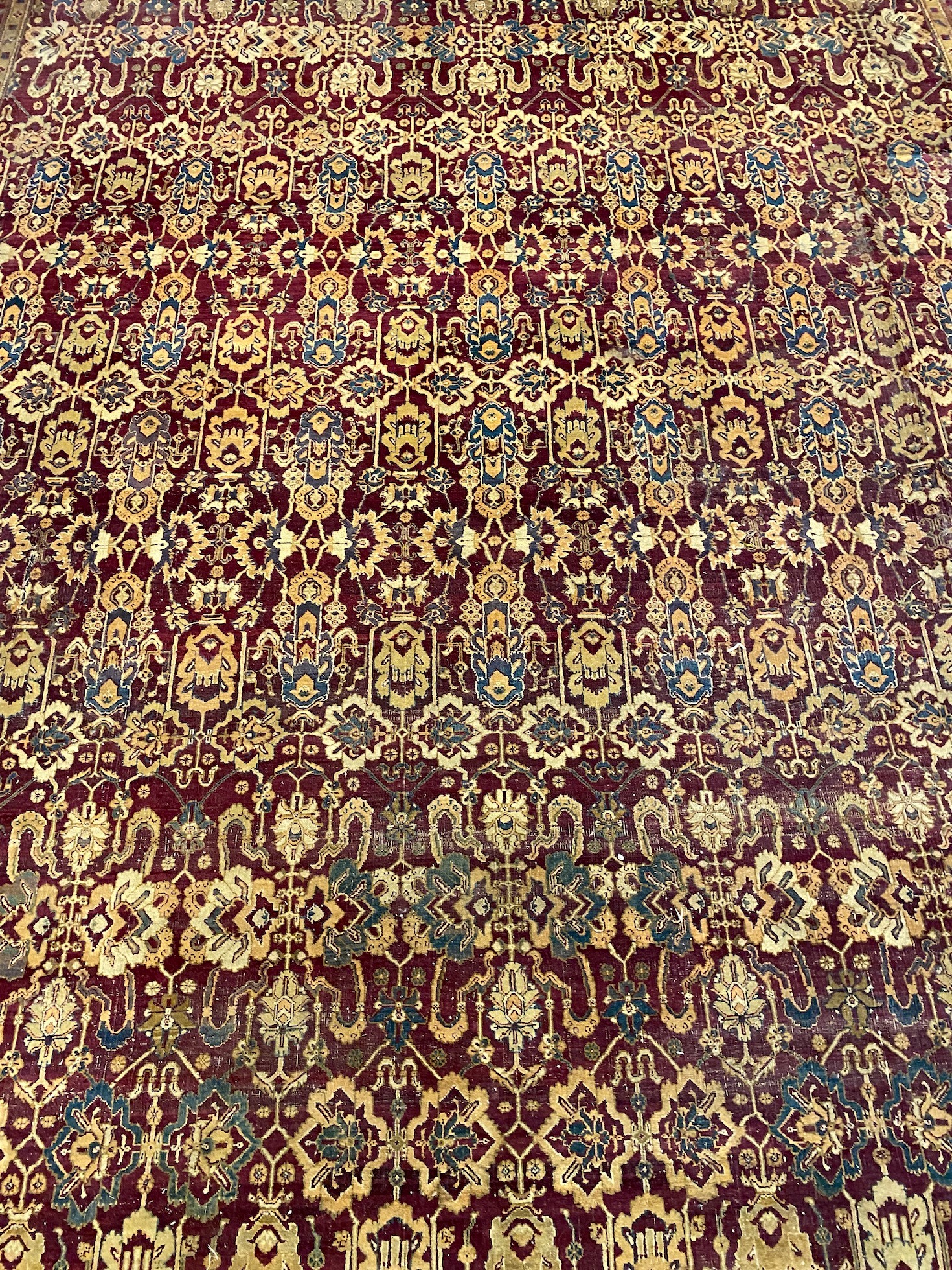 A large Sarouk purple ground carpet, approx. 20ft x 12ft. (cut in one area)